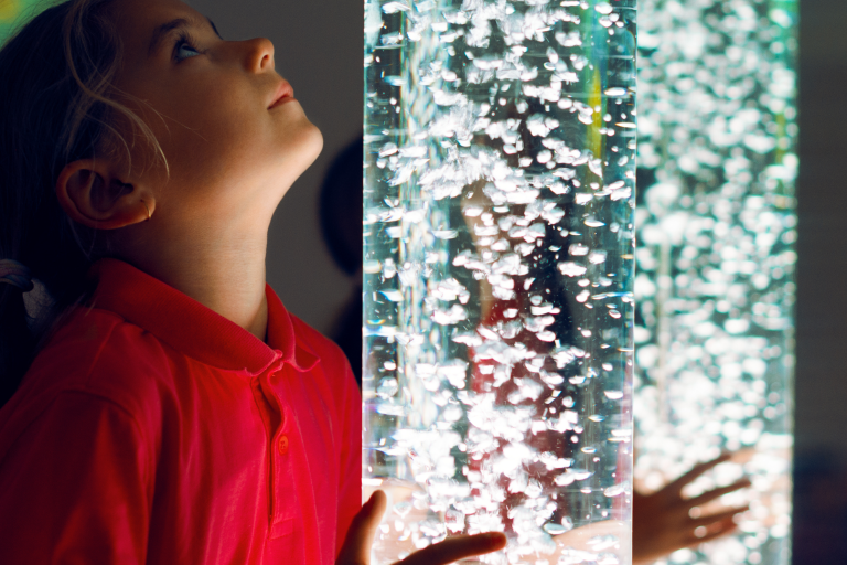 Image of girl with sensory light tube