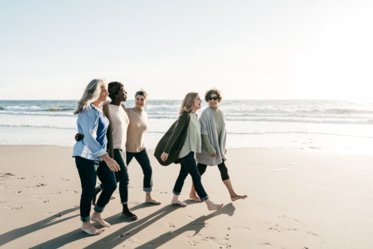 women walking on beach