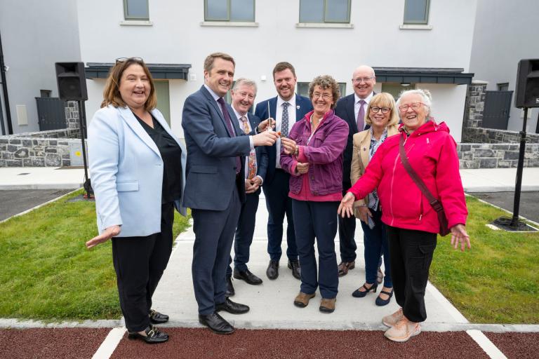 Galway_Minister2 **No repro fee** Una Jordan (centre) and Kristy Verenga (right), receiving the keys to their new homes from James Browne TD, Minister for Housing, Local Government and Heritage at the newly opened 10-unit social housing scheme at Caisleán Raithin in Ardrahan. Also pictured left to right Senator Anne Rabbitte; Minister of State Seán Canney TD; Senator Shane Curley; Liam Conneally, Chief Executive of Galway County Council; and Cllr Martina Kinane. Credit Andrew Downes / XPOSURE.