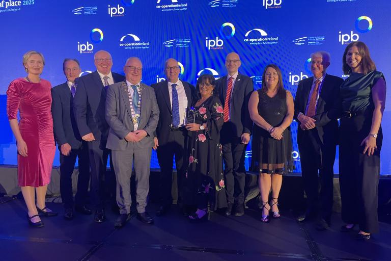 People receiving the award on stage