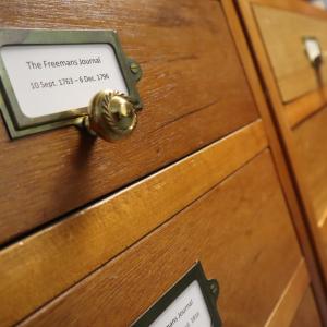 Image of wooden drawers one labeled the Freeman's Journal