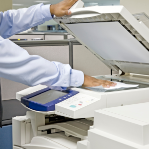 Image of man using photocopier