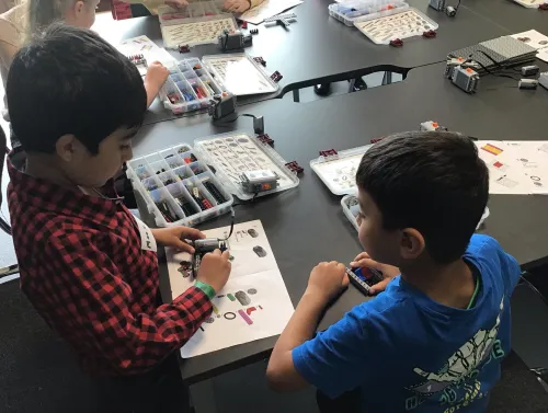 Image of two boys making a robot with mechano